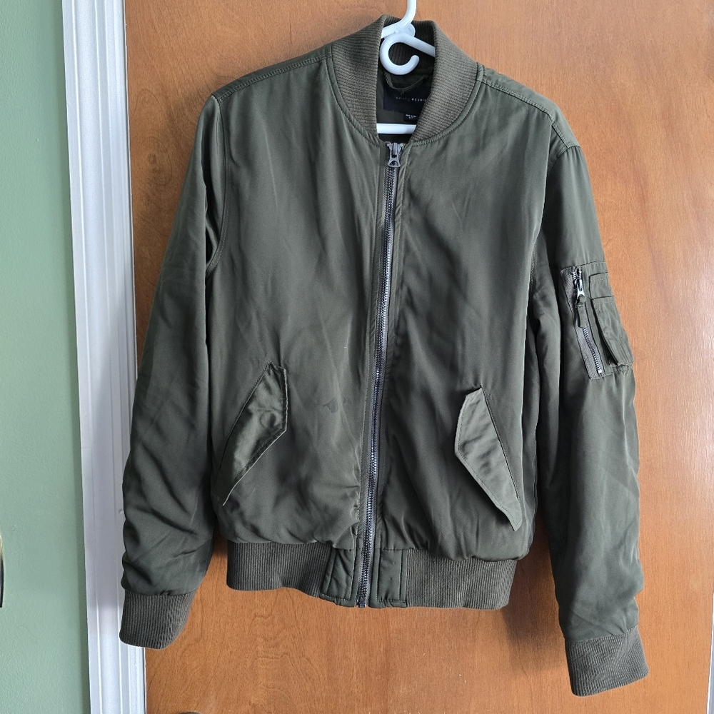 The MA-1 bomber jacket by Among Equals is a military-style flight jacket